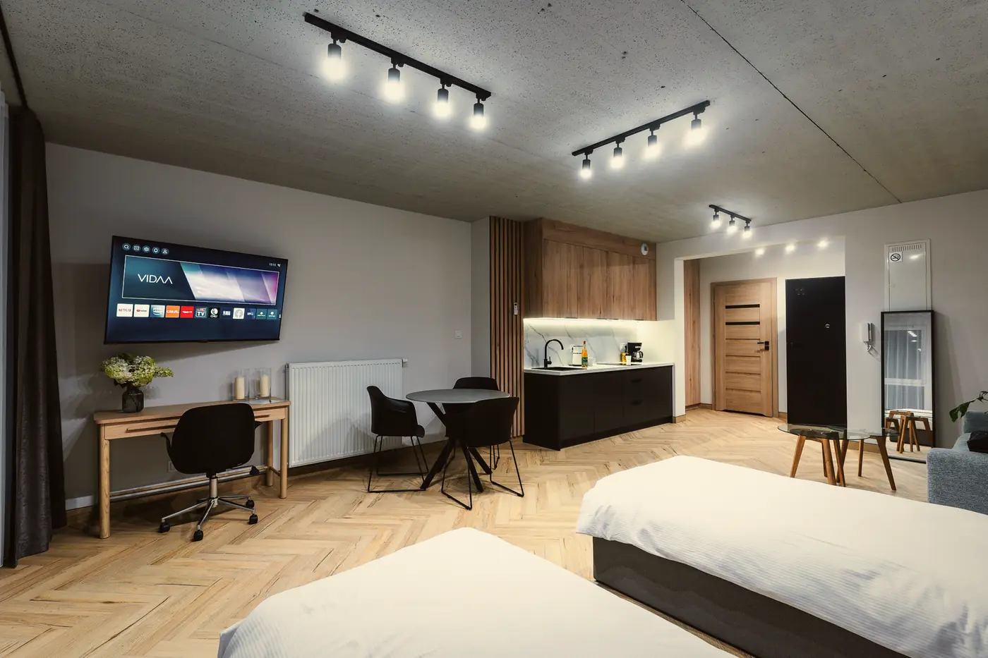 Apartament Deluxe z otwartą strefą dzienną i aneksem kuchennym